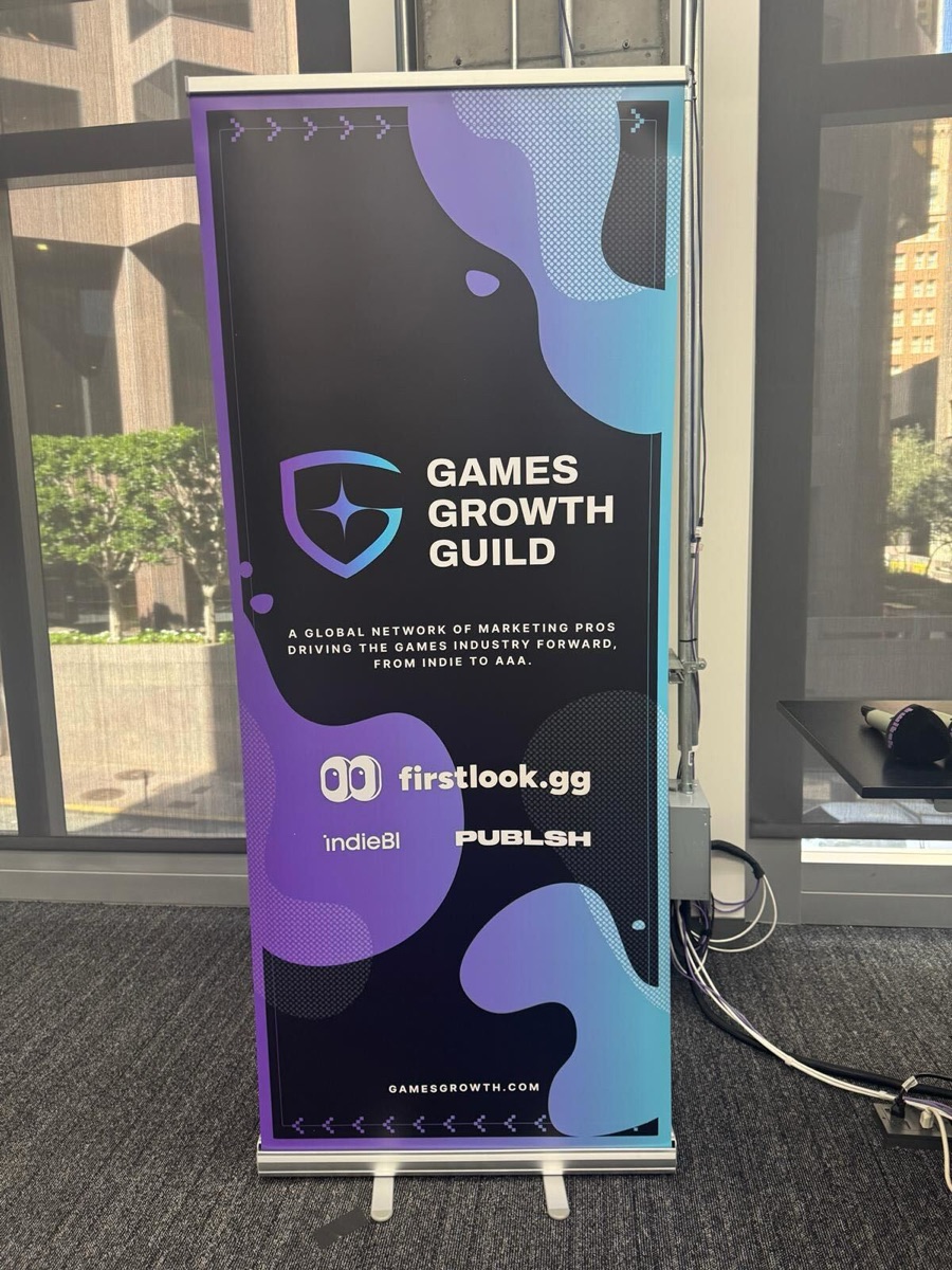 Games Growth Guild event banner at a venue with city views